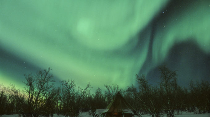 northern lights over teepee