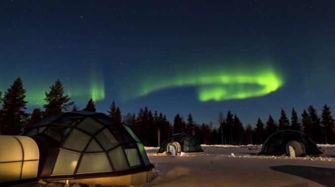 northern lights over the glass igloos at kakslauttanen