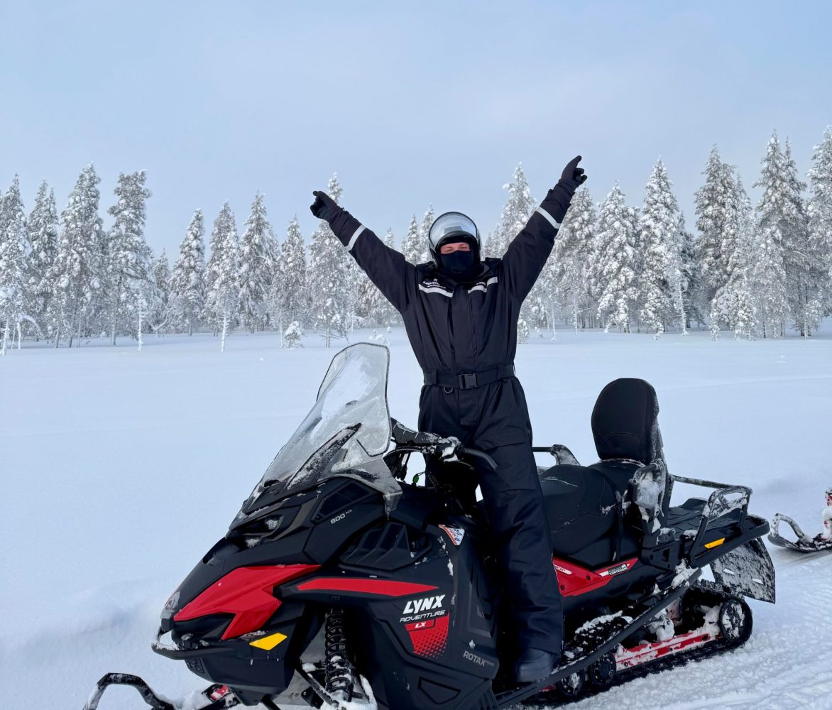 Liam on a snowmobile in Finland